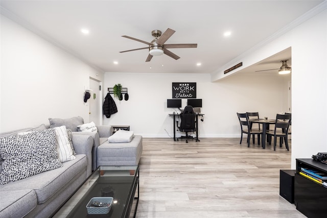living room with ceiling fan, crown molding, light wood-style floors, recessed lighting, and baseboards