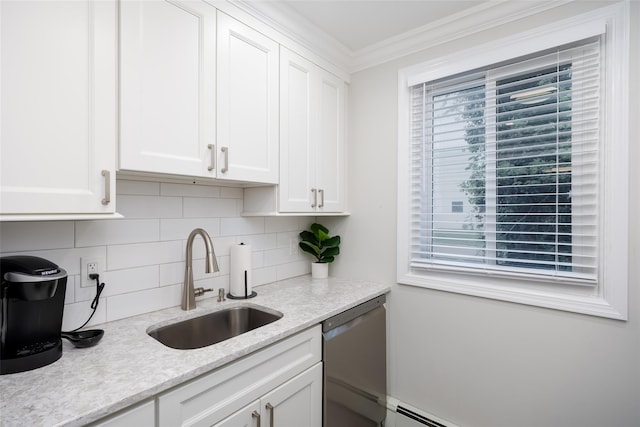 kitchen with stainless steel dishwasher, a sink, white cabinets, decorative backsplash, and ornamental molding