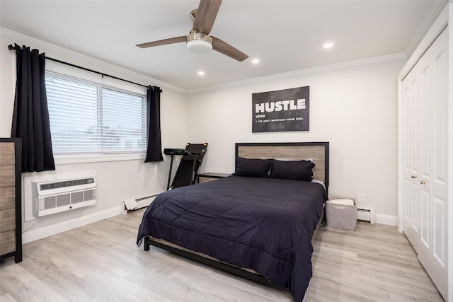 bedroom featuring an AC wall unit, a closet, a baseboard heating unit, baseboards, and ornamental molding