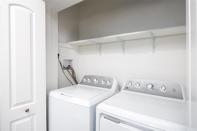 washroom featuring washer and dryer