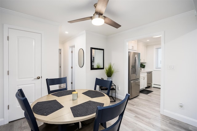 200 Merrick Rd Unit F, Amityville, NY 11701 - dining space with ceiling fan, baseboard heating, light wood finished floors, recessed lighting, and crown molding