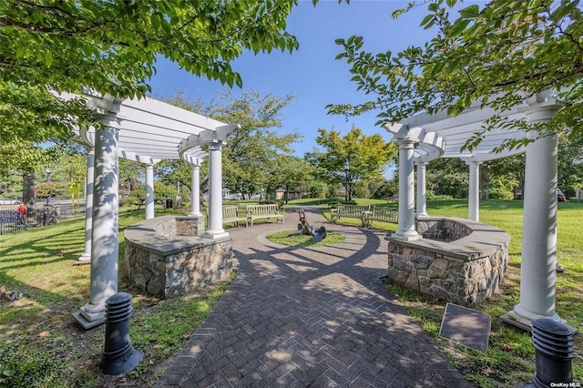 200 Merrick Rd Unit F, Amityville, NY 11701 - view of patio / terrace featuring a pergola