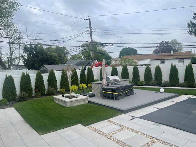 view of home's community with a fenced backyard, a wooden deck, and a yard