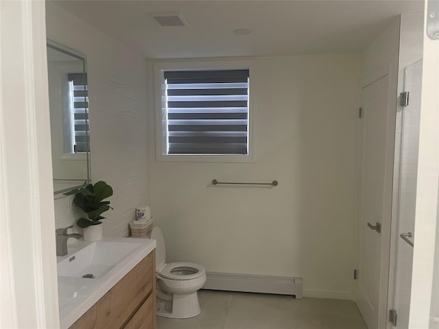 bathroom with a baseboard heating unit, toilet, visible vents, tile patterned floors, and vanity