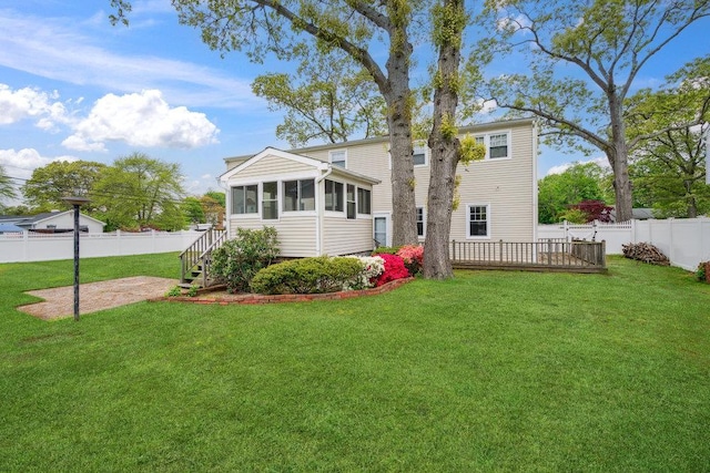 16 Edwards Ln E, Blue Point, NY 11715 - back of property with a sunroom and a patio