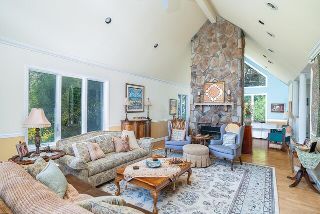 235 S Blvd, Nyack, NY 10960 - living room with healthy amount of natural light, light wood finished floors, beamed ceiling, high vaulted ceiling, and a stone fireplace