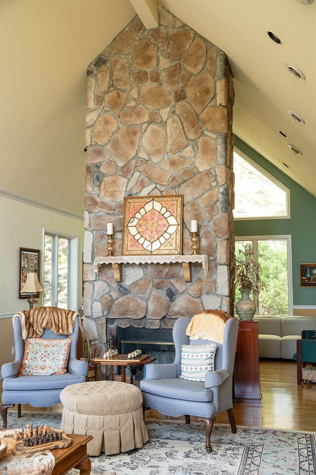 235 S Blvd, Nyack, NY 10960 - living room featuring high vaulted ceiling, wood finished floors, a stone fireplace, and beam ceiling