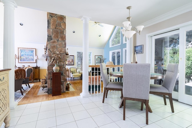 235 S Blvd, Nyack, NY 10960 - dining space featuring decorative columns, light tile patterned floors, vaulted ceiling, crown molding, and a chandelier