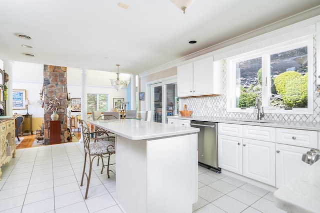 235 S Blvd, Nyack, NY 10960 - kitchen with dishwasher, a sink, a breakfast bar, light countertops, and backsplash