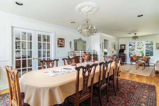 235 S Blvd, Nyack, NY 10960 - dining room featuring a chandelier, crown molding, wood finished floors, and french doors