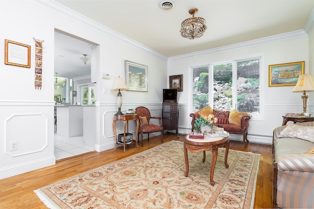 235 S Blvd, Nyack, NY 10960 - living room featuring crown molding, a baseboard heating unit, and wood finished floors
