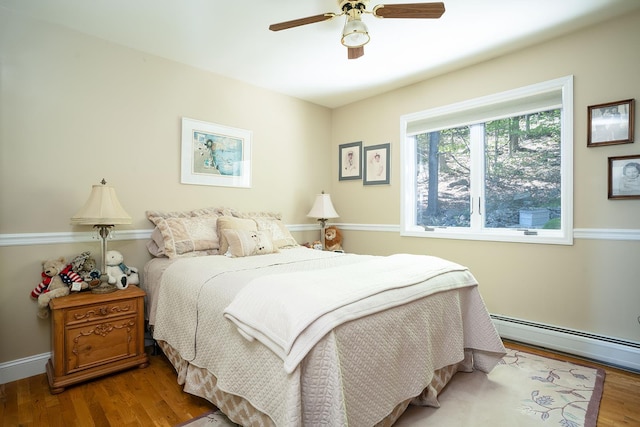 235 S Blvd, Nyack, NY 10960 - bedroom with a baseboard radiator, wood finished floors, and a ceiling fan