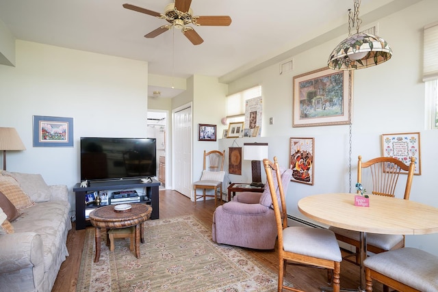 235 S Blvd, Nyack, NY 10960 - living room featuring a ceiling fan, wood finished floors, and a baseboard heating unit
