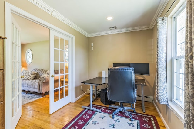 office with french doors, wood finished floors, visible vents, and a healthy amount of sunlight