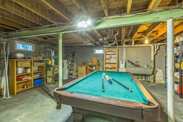 recreation room featuring water heater, billiards, concrete floors, and a sink