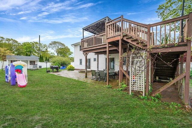 back of property featuring a patio, a yard, and a deck