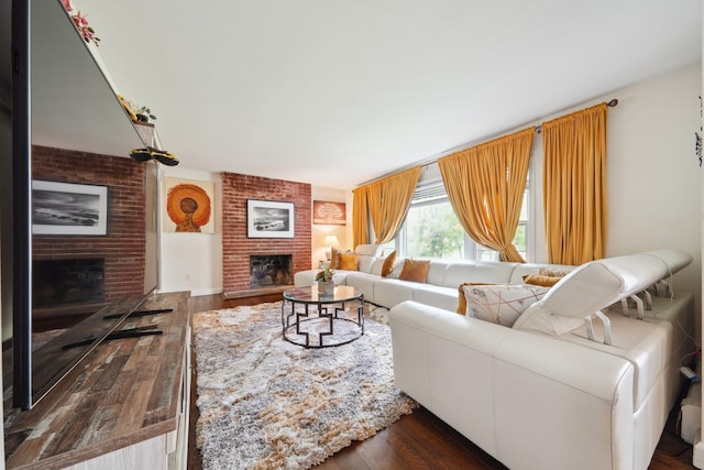 living room featuring a fireplace and dark wood-type flooring