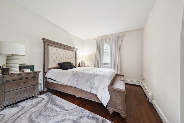 bedroom featuring wood finished floors and baseboards