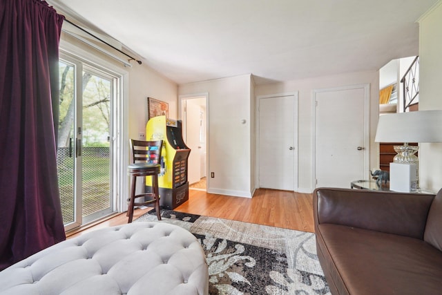 interior space featuring baseboards and wood finished floors