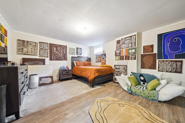 bedroom with wood finished floors