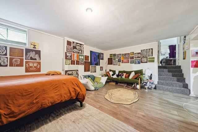 bedroom with wood finished floors