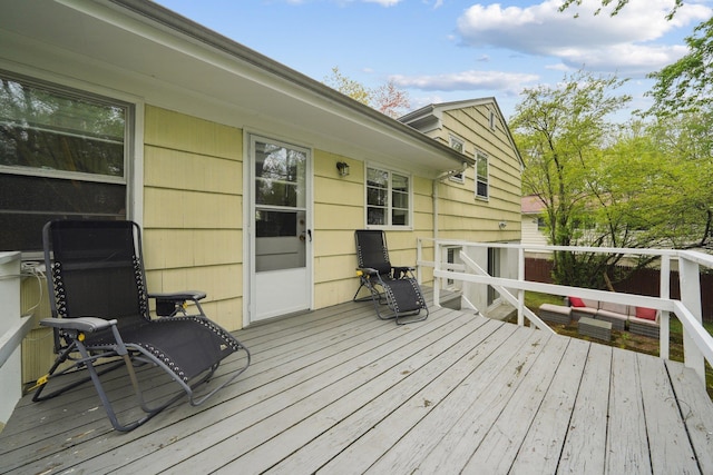 wooden deck featuring an outdoor hangout area