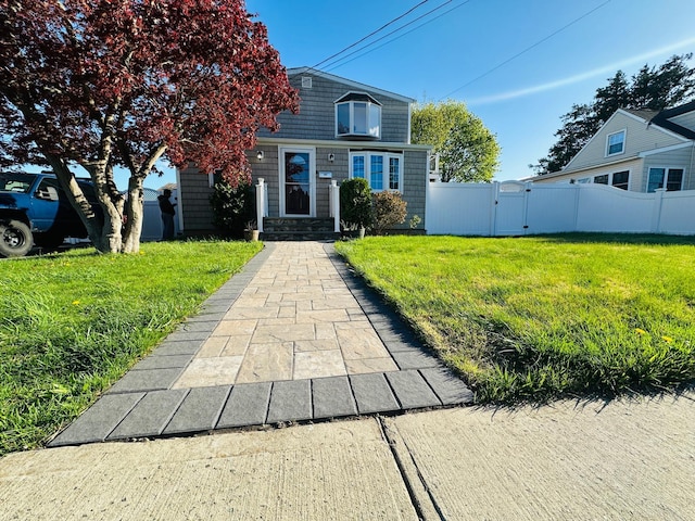 10 N Crescent Dr, Farmingdale, NY 11735 - view of front of property featuring fence, a gate, and a front lawn
