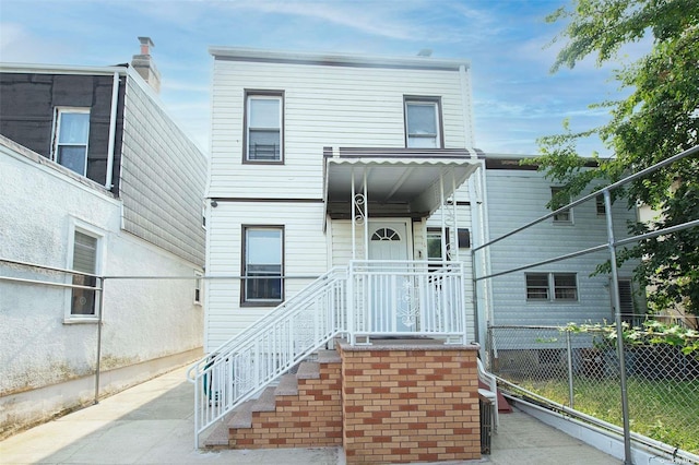 view of front of property with fence
