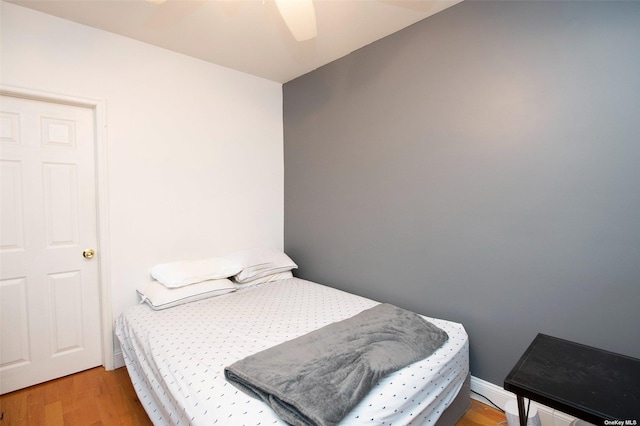bedroom featuring light wood-style floors and ceiling fan