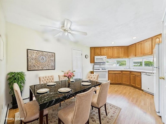 dining area featuring baseboard heating, light wood-type flooring, ceiling fan, and recessed lighting