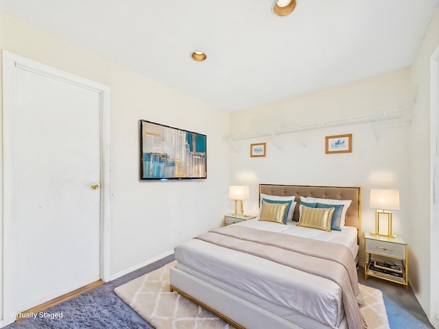 bedroom with recessed lighting and baseboards