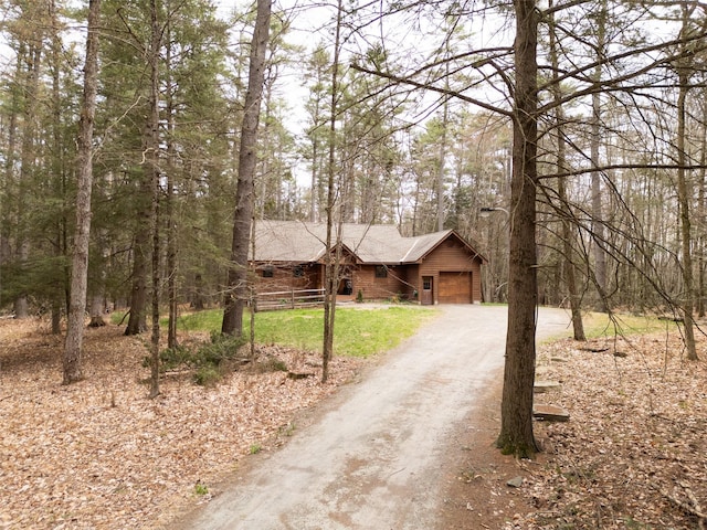 15 Chapin Trl, White Lake, NY 12720 - log cabin featuring an attached garage, a wooded view, and dirt driveway