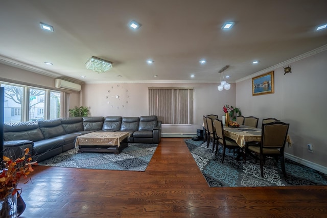 living area with recessed lighting, wood finished floors, ornamental molding, and an AC wall unit