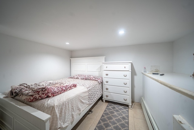 bedroom with baseboard heating and recessed lighting