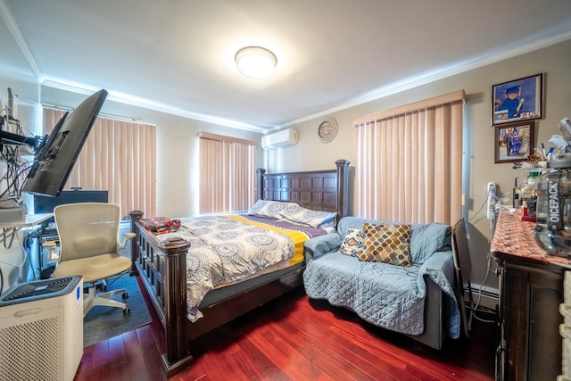 bedroom featuring ornamental molding, wood finished floors, and a wall unit AC