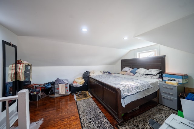 bedroom featuring vaulted ceiling and wood finished floors