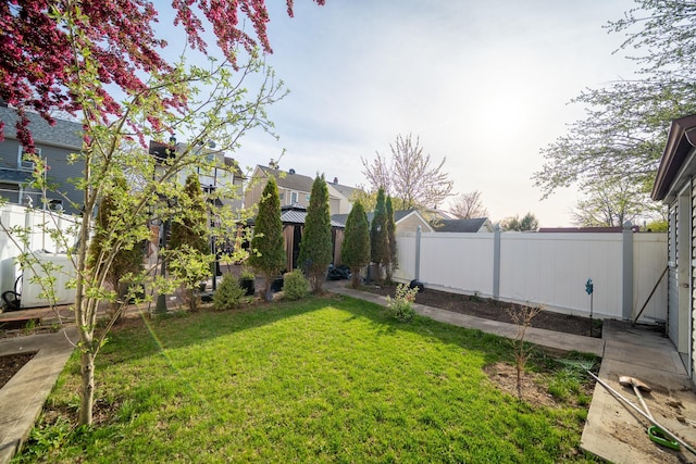 view of yard featuring a fenced backyard