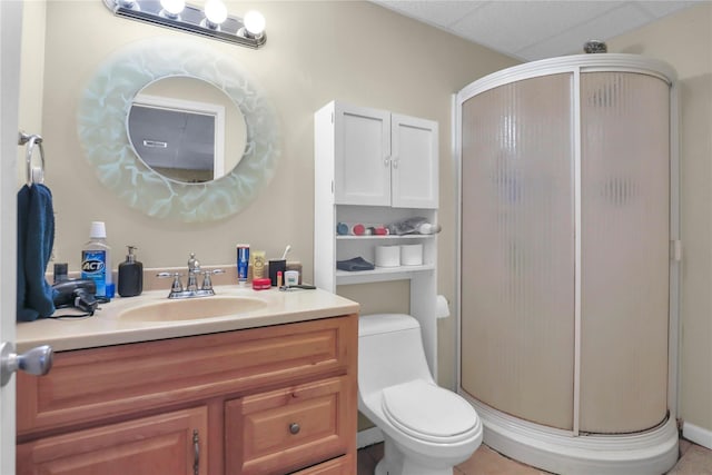 bathroom featuring a stall shower, vanity, and toilet