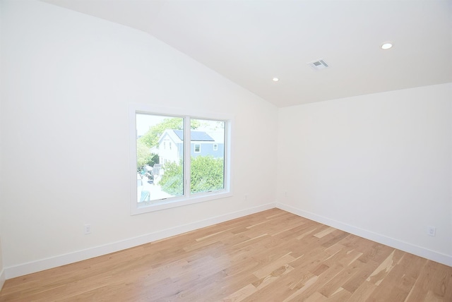 141 Flamingo St, Atlantic Beach, NY 11509 - empty room featuring vaulted ceiling, light wood-style flooring, baseboards, and recessed lighting