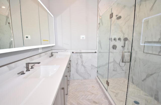 141 Flamingo St, Atlantic Beach, NY 11509 - full bath featuring a marble finish shower, tile walls, and double vanity