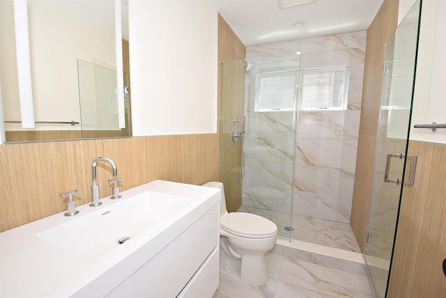 141 Flamingo St, Atlantic Beach, NY 11509 - full bathroom with a marble finish shower, marble look tiles, toilet, a wainscoted wall, and vanity