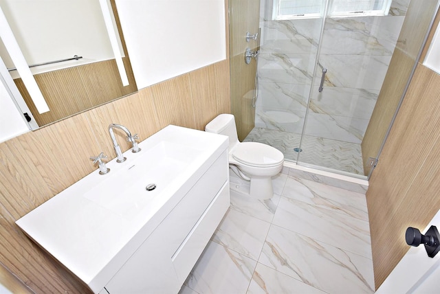 141 Flamingo St, Atlantic Beach, NY 11509 - bathroom with a shower stall, toilet, marble finish flooring, a wainscoted wall, and vanity