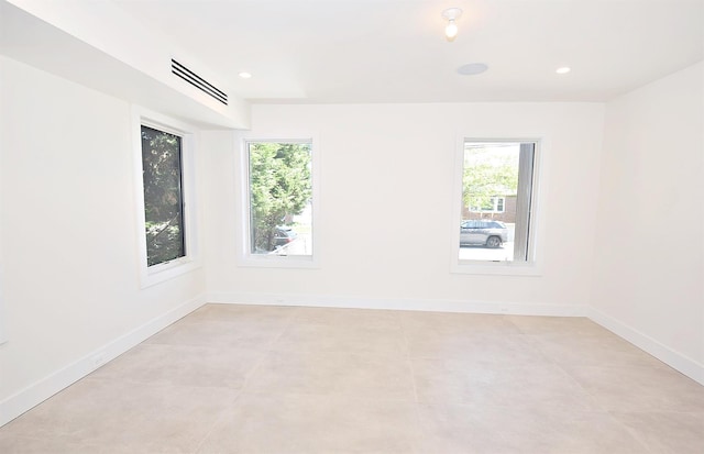 141 Flamingo St, Atlantic Beach, NY 11509 - empty room with plenty of natural light, baseboards, and recessed lighting