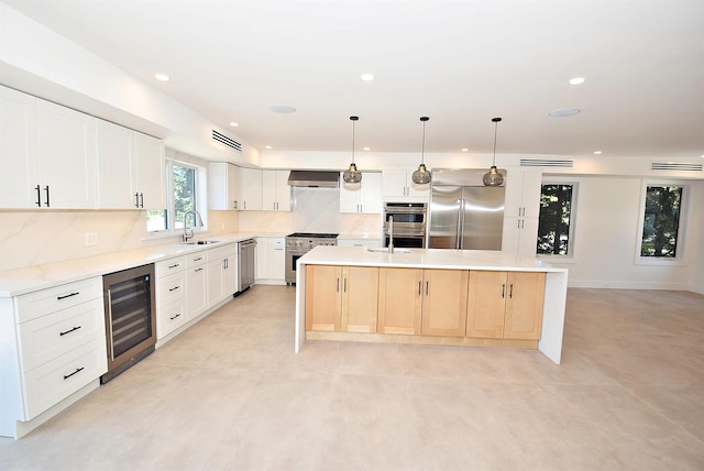 141 Flamingo St, Atlantic Beach, NY 11509 - kitchen featuring stainless steel appliances, wine cooler, a sink, backsplash, and recessed lighting