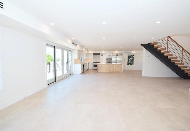141 Flamingo St, Atlantic Beach, NY 11509 - unfurnished living room featuring stairs, recessed lighting, and baseboards