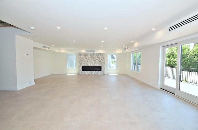 141 Flamingo St, Atlantic Beach, NY 11509 - unfurnished living room with recessed lighting, baseboards, and a large fireplace