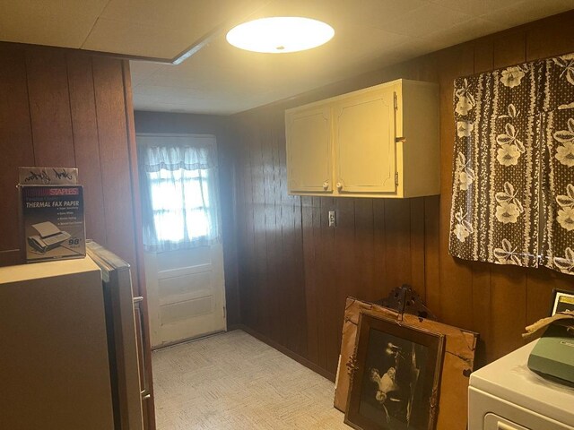 160-38 85th St, Howard Beach, NY 11414 - laundry area with wood walls, washer / dryer, and light floors