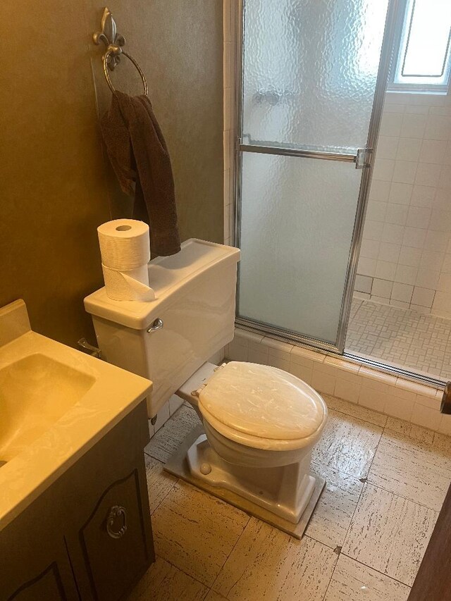 160-38 85th St, Howard Beach, NY 11414 - full bathroom with a tile shower, toilet, and vanity