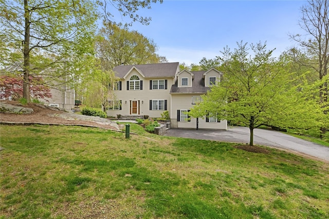26 Garrity Blvd, Brewster, NY 10509 - colonial home featuring a patio and a front yard