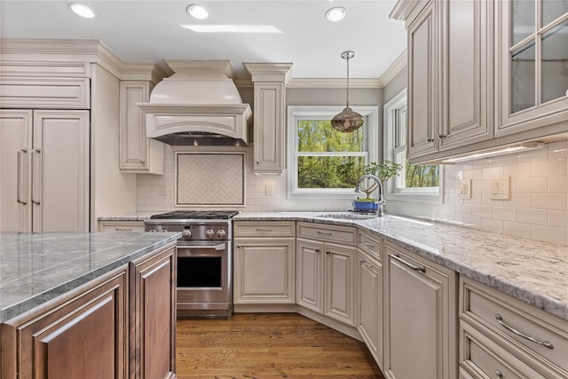 26 Garrity Blvd, Brewster, NY 10509 - kitchen with stainless steel stove, premium range hood, a sink, and light stone countertops